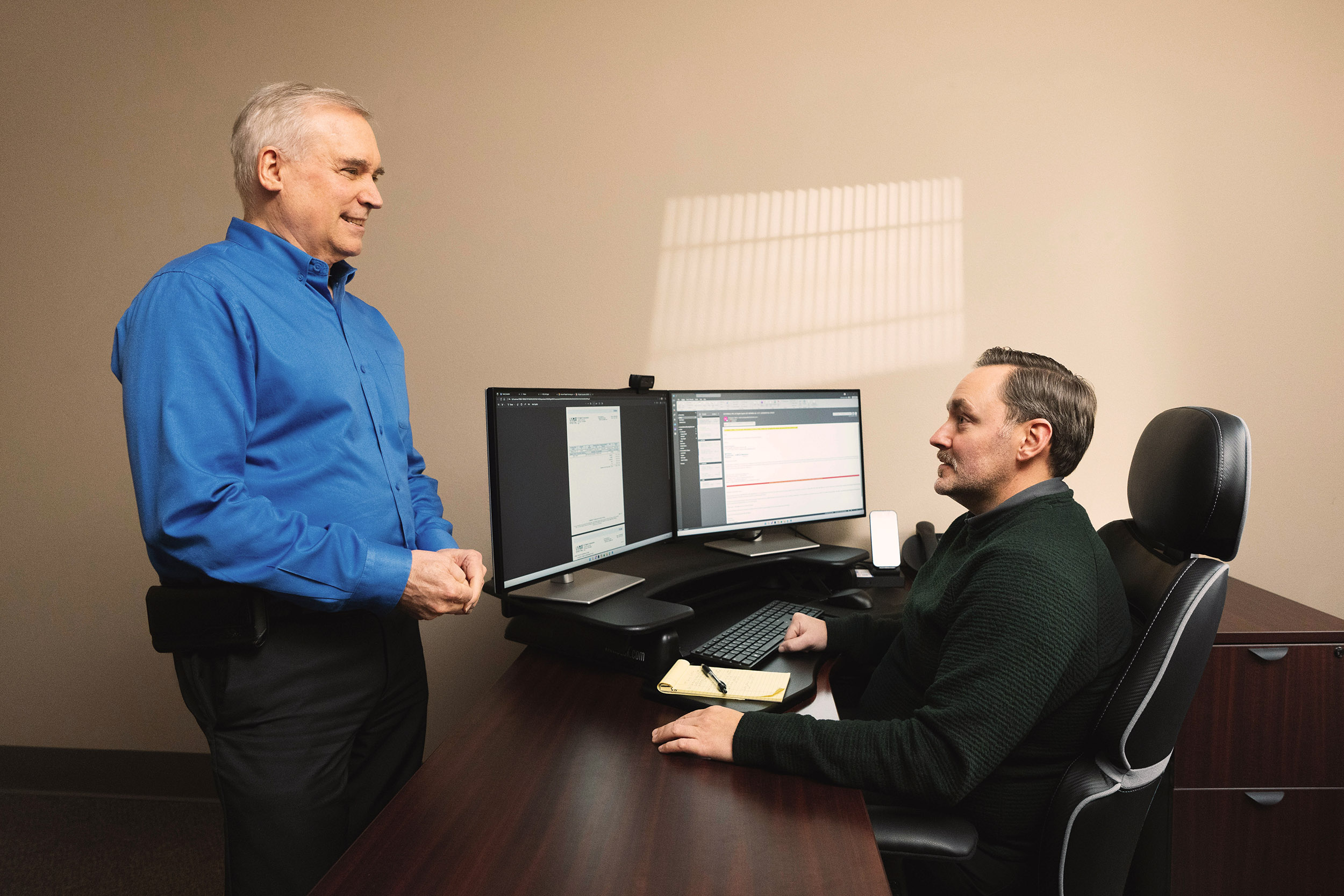 David Madore talking with new employee