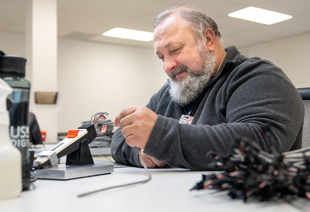 Applying heat shrink tubing to cables